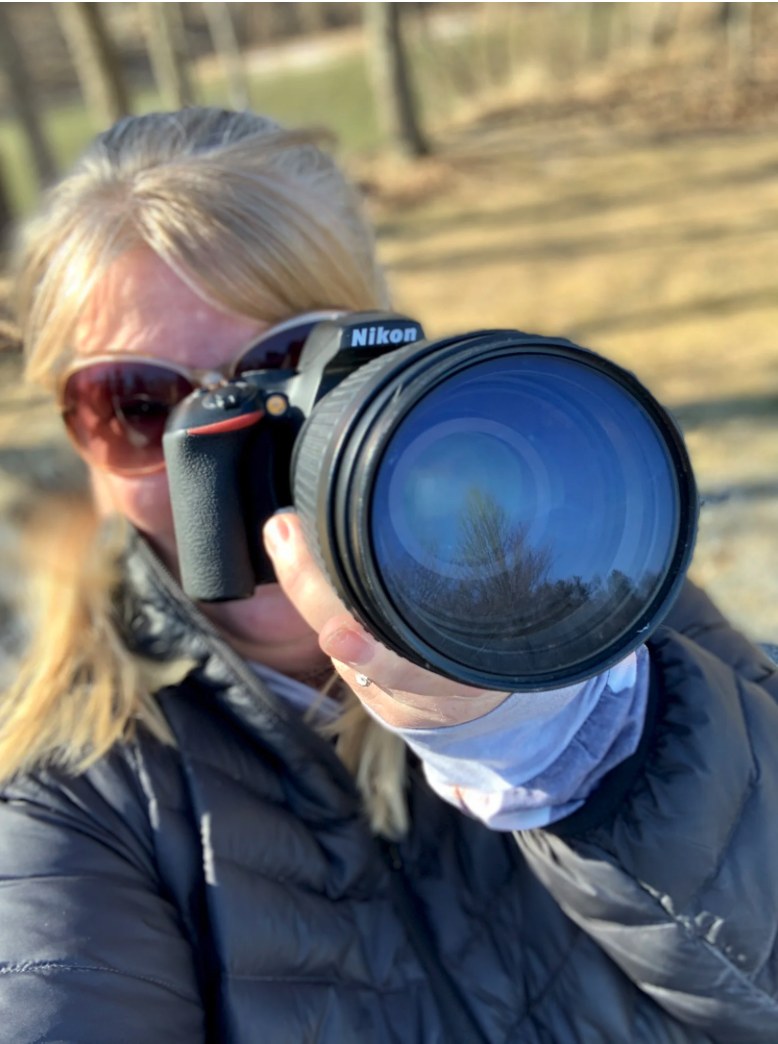 Amy Crawford photographing on location