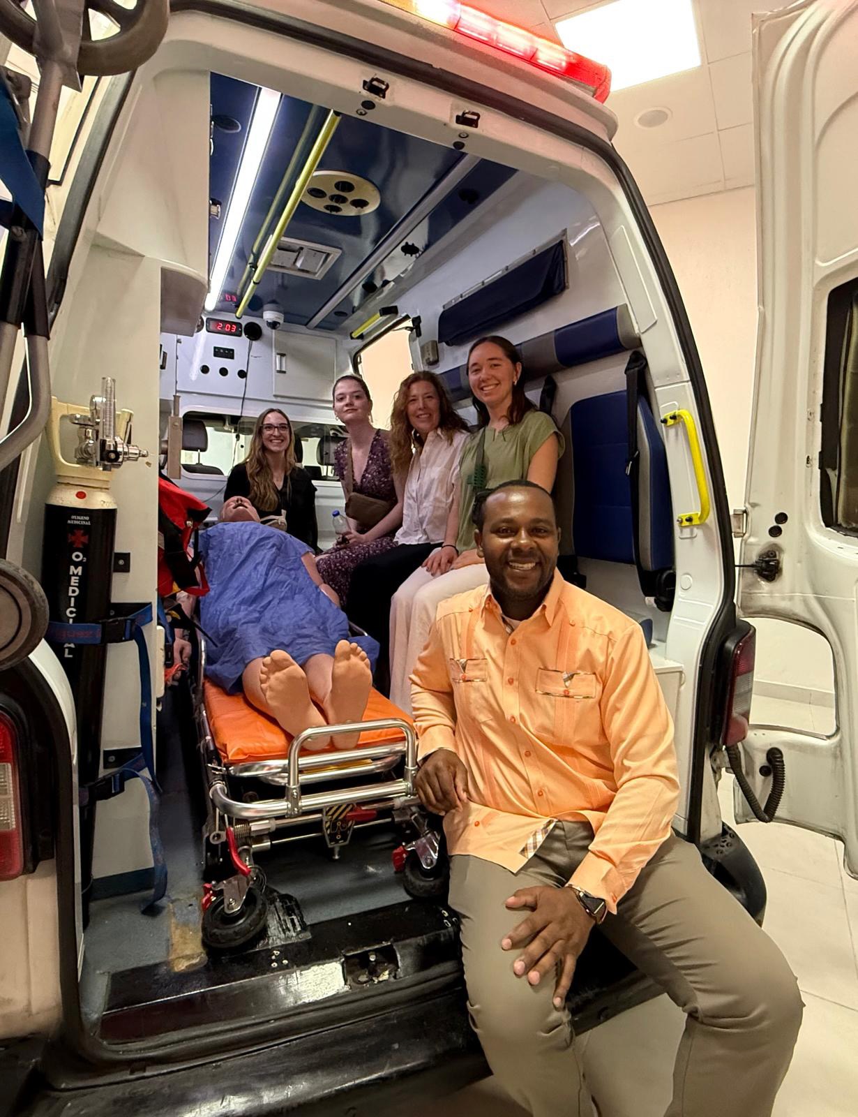 Students and an EMT inside a mobile ambulance in the Dominican Republic